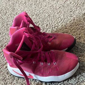 Nike Kids Shoes in Pink and White basketball shoes. Good traction, ankle support